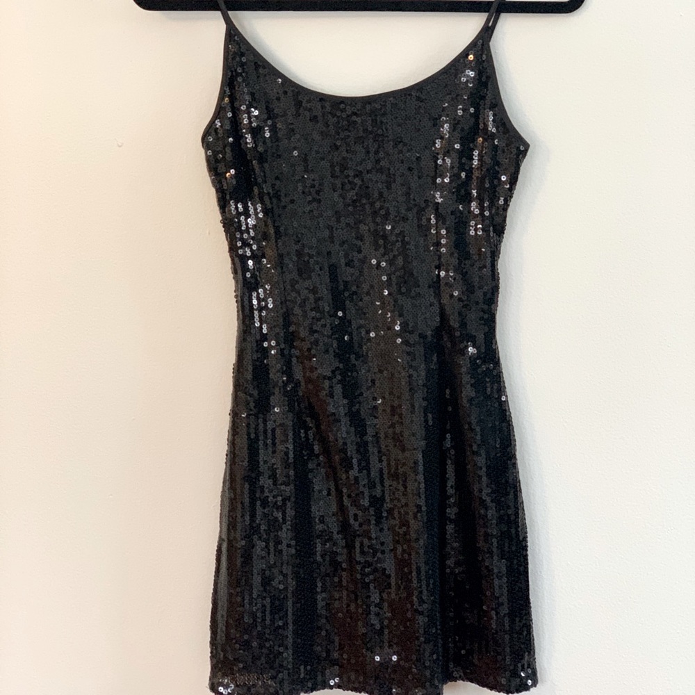 Short, black sequin party dress.